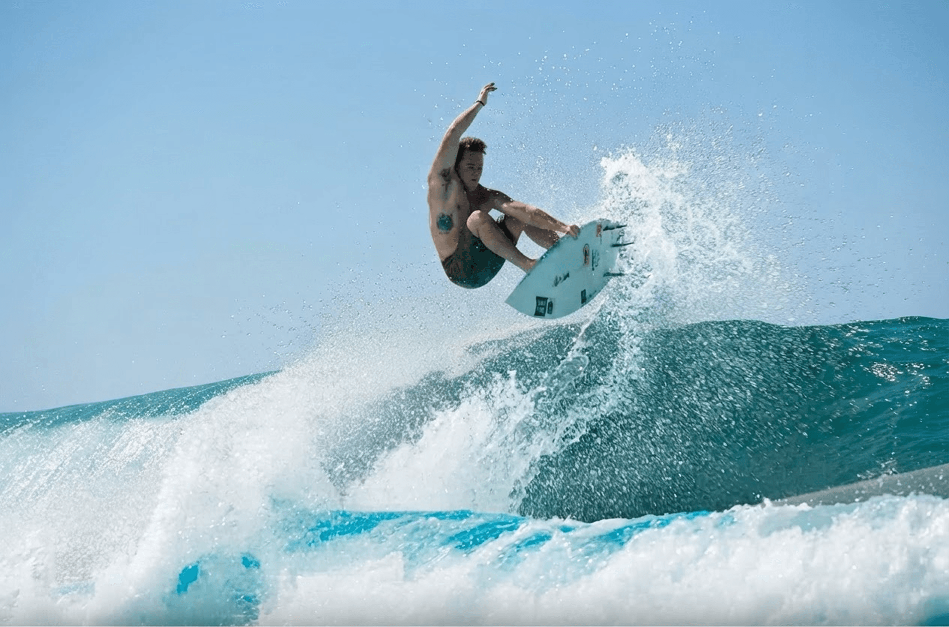 Surfer riding a wave at a Swell Pass partner pool